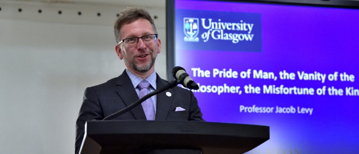 Jacob Levy standing in front of a presentation and in front of him a lecture Source: Charlotte Morris