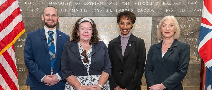 Cecilia Rouse and Sara with two more people standing in front of the foundation stone Source: Charlotte Morris