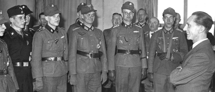 Nazi leader Joseph Goebbels, Reich Minister for Propaganda, talks with Waffen SS and Wehrmacht soldiers he has decorated, March 1944 (Scherl/Sueddeutsche Zeitung Photo)