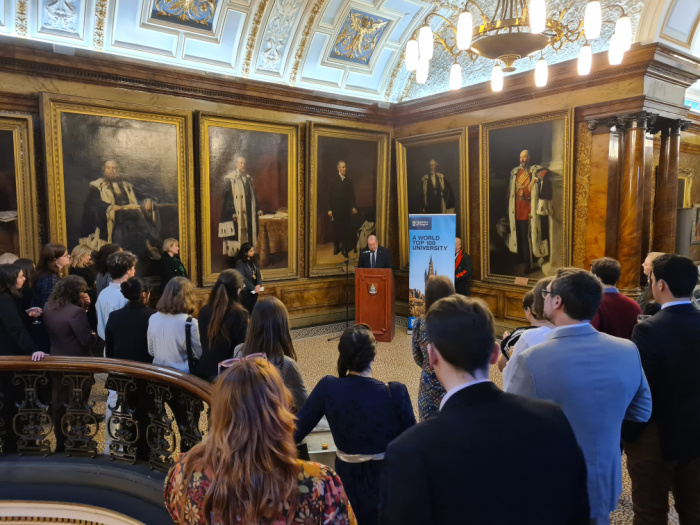 Guests gathered around listening to a speech at a Civic Reception at Glasgow City Chambers
