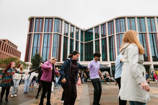 People dancing in a Ceilidh outside the ARC
