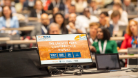 A photo of the EGPA conference slide reading The largest EGPA conference in history, 900+ submissions, 800 participants, 30 tracks