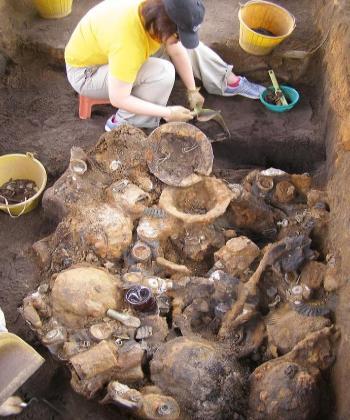 Uncovering of an old ARP trench whilst digging for 14th / 15th Century pottery on the Padang; the historic ceremonial area opposite the City Hall and Supreme Court, in the very heart of the city. Contains mainly steel helmets and Mk V Respirators.
