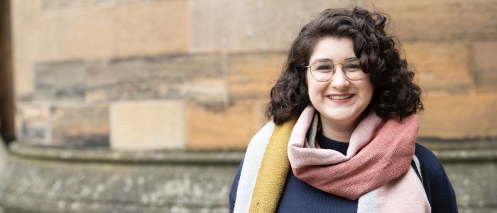 One student standing in the west quadrant