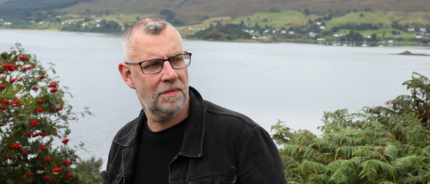 Graeme Macrae Burnet (MA 1989) by a Loch in the Highlands