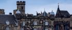 Turret and roof of Edinburgh castle. Blue sky in background.