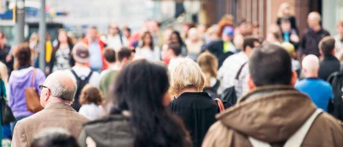 Crowds on Princes Street, seen mostly from the back, one of Scotland's largest and busiest shopping streets, in Edinburgh. Source: georgeclerk | iStockphoto  https://www.istockphoto.com/photo/city-pavement-busy-with-pedestrians-gm840975092-137367407