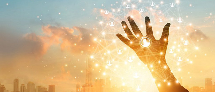 A hand reaching up to the sky with a sunset and city in the background and a representation of a network of people. Image credit: ipopba | iStockphoto  https://www.istockphoto.com/photo/businessman-touching-icon-customer-in-hand-with-global-network-connection-and-data-gm1025744866-275130902