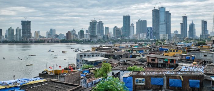 View of Mumbai skyline with skyscrapers over slums in Bandra suburb.