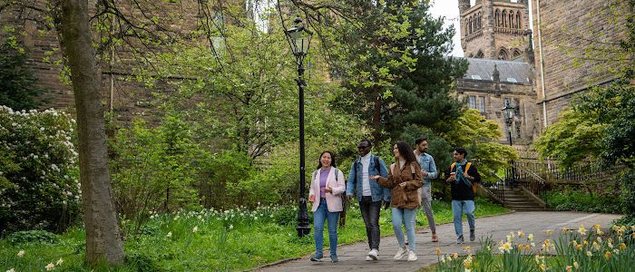Group of students walking through Gilmorehill campus