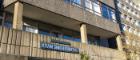 Adam Smith Building exterior with sign