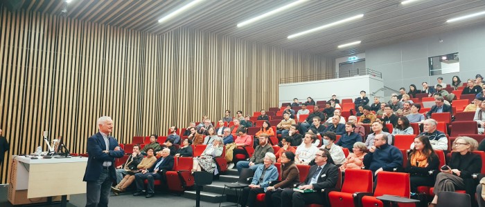Tong Aspromourgos standing speaking to a lecture theatre filled with people. Source: University of Sydney